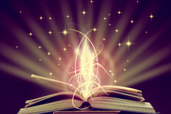  open book with shining light bursting out