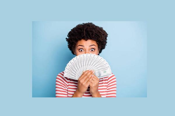 woman with money fanned out