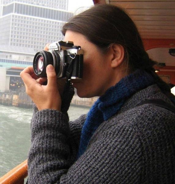 woman taking picture with camera